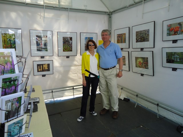 Me at the art show with my personal framer and booth erector